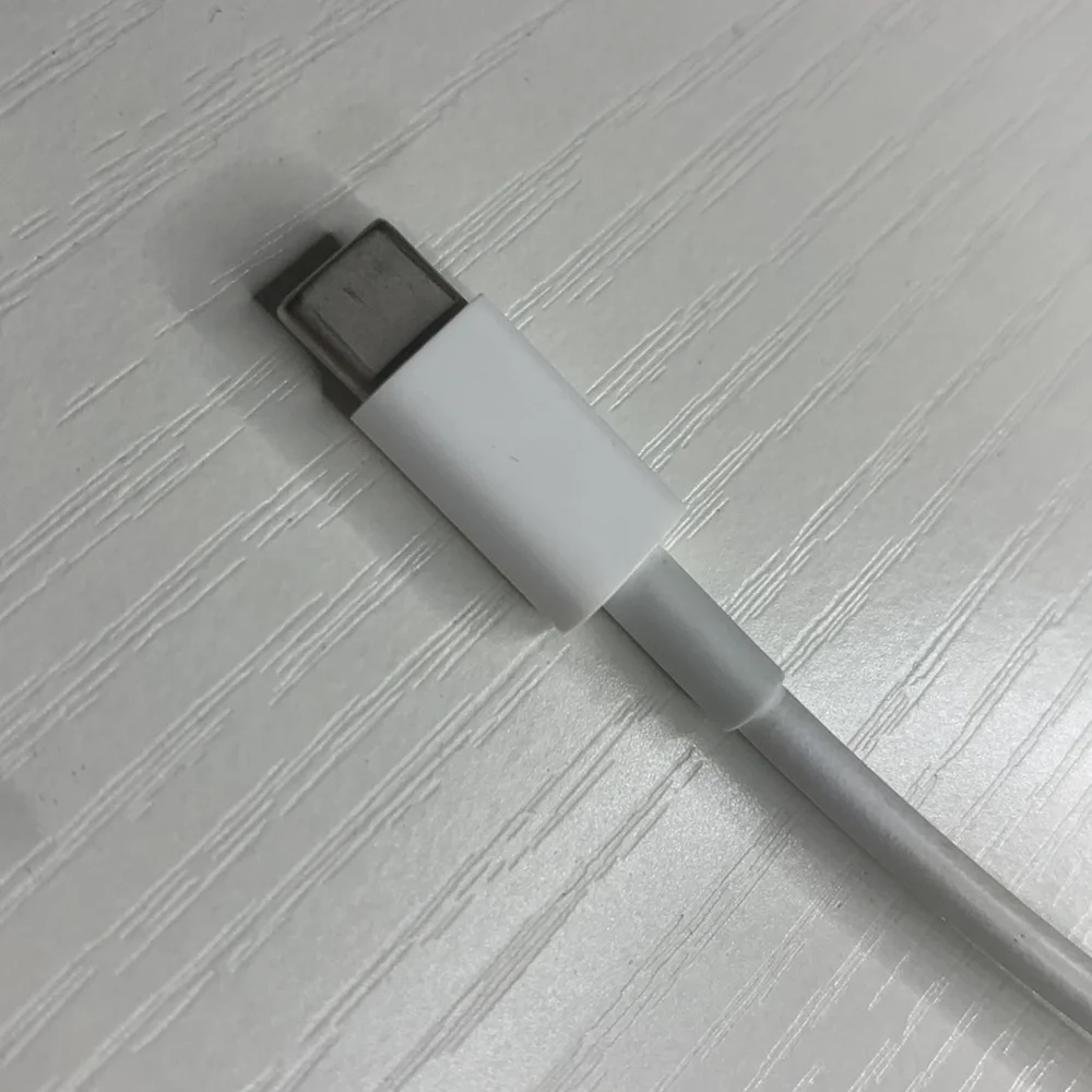 white MacBook adapter